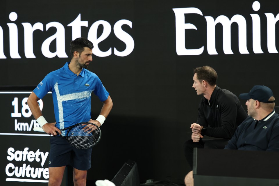 MELBOURNE, AUSTRALIA - JANUARY 13: Novak Djokovic of Serbia speaks with his coach, Andy Murray, against Nishesh Basavareddy of the United States in the Men's Singles First Round match during day two of the 2025 Australian Open at Melbourne Park on January 13, 2025 in Melbourne, Australia. (Photo by Cameron Spencer/Getty Images)