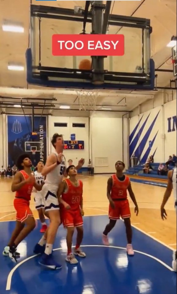 He towers over much smaller defenders