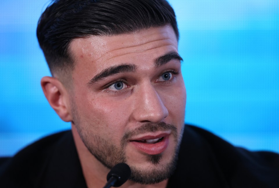 Close-up of Tommy Fury at a press conference.